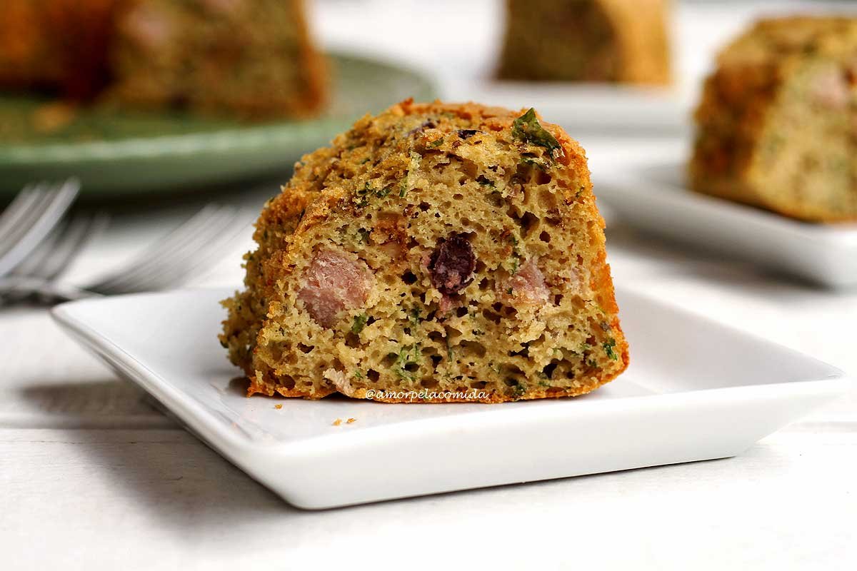 Slice of sweet potato cake on white square plate on white table