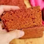 Hand holding slice of beetroot bread